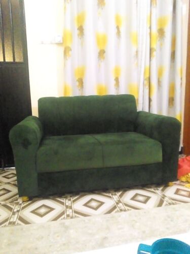 Two seater emerald green sofa